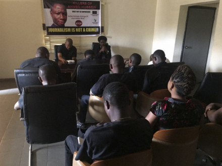 Mourners share a minute’s silence