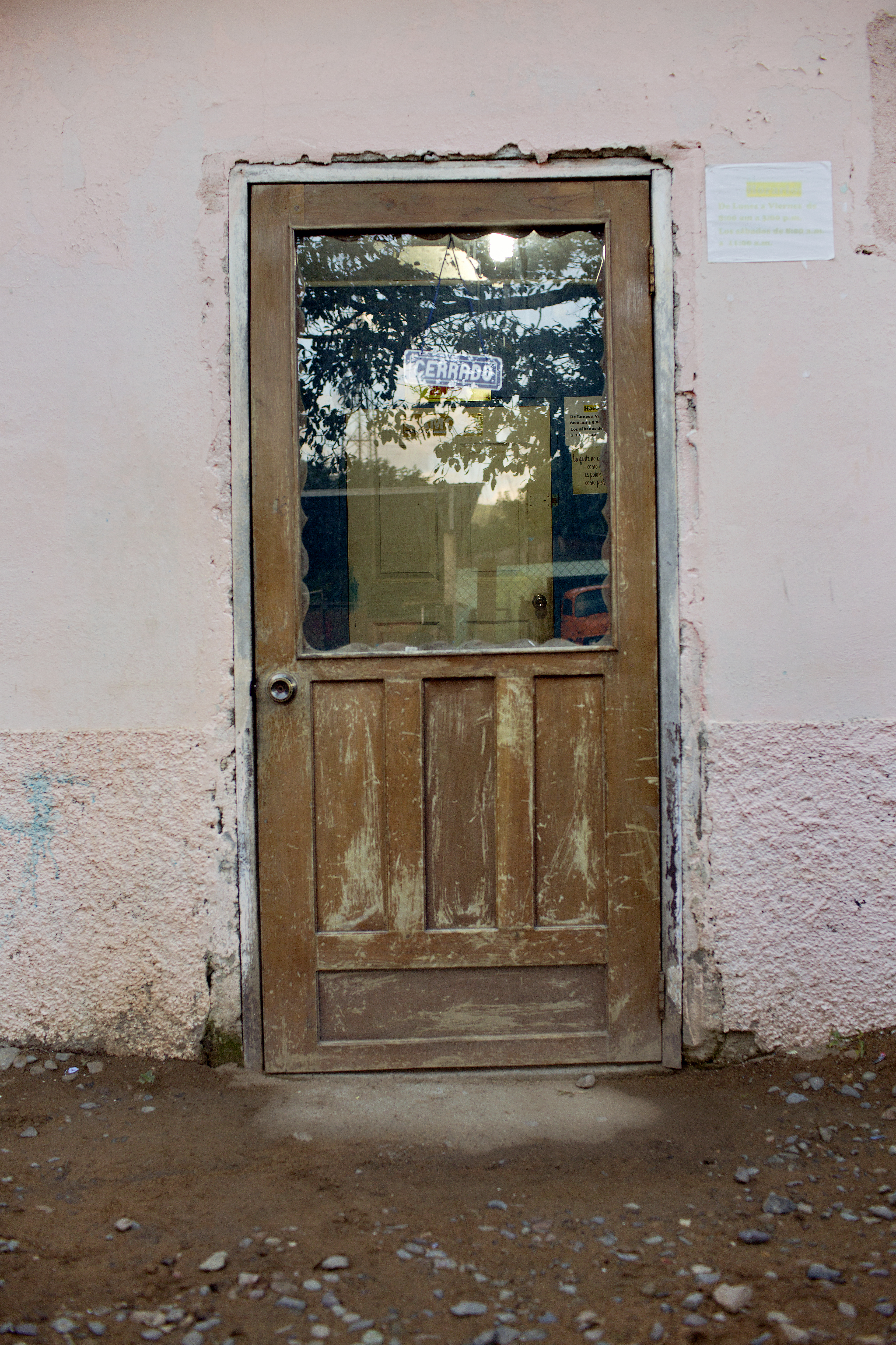 A sign marked 'cerrado,' or closed, hangs on the door of the organization in the La Confianza cooperative, where José Ángel Flores was a leader
