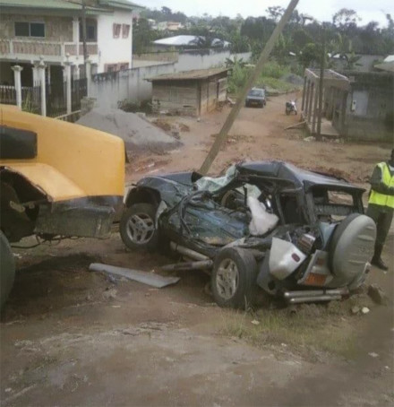 Koum Koum's vehicle and the timber truck that crushed it