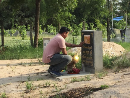 Wutty's son at a memorial at the scene of the shooting